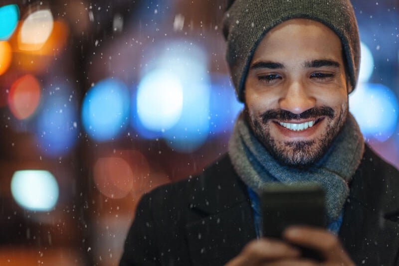 Young man on a mobile device securely accessing his account information online