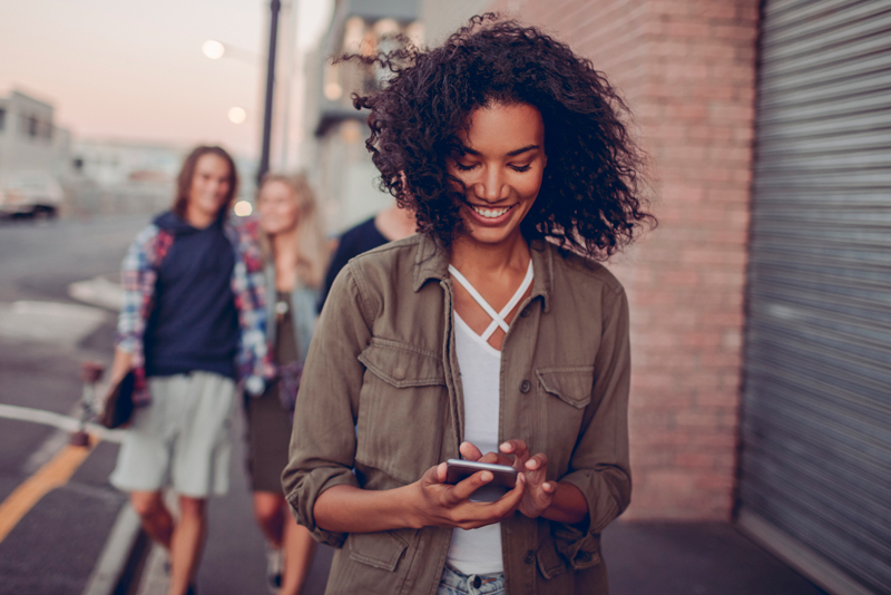 A woman looking at her mobile phone