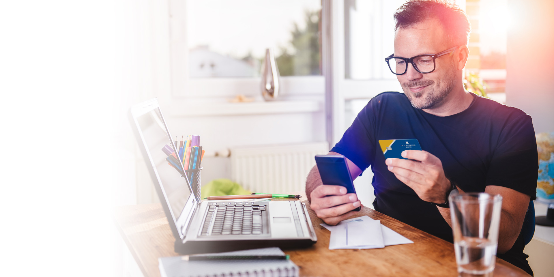 A man updating his card information on his mobile device