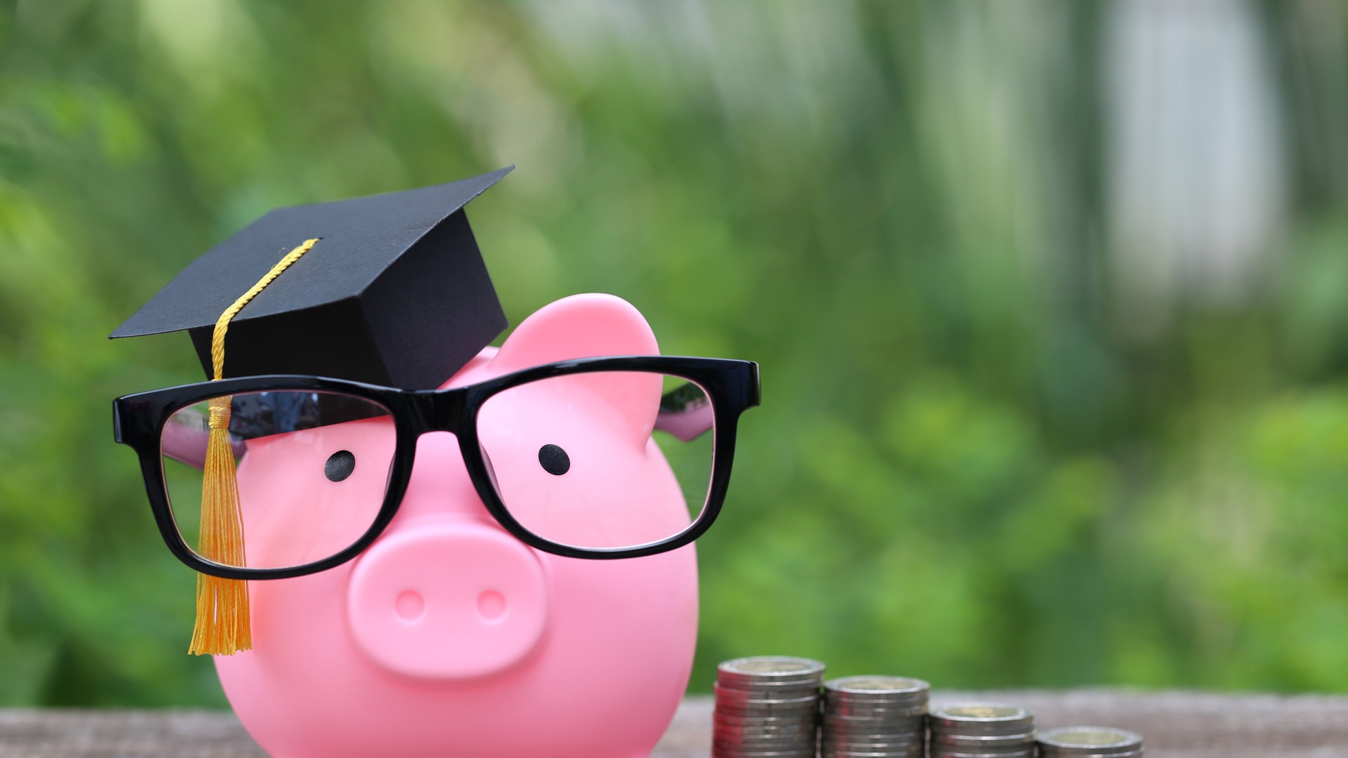 A piggy bank with a graduation cap