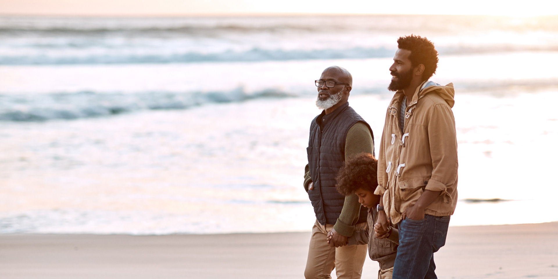 A family walking on the beach